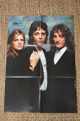 Lot 60 - An autographed Wings poster, signed by Paul...
