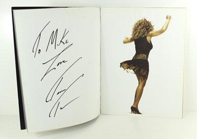 Lot 64 - A Tina Turner autographed tour programme 1990,...
