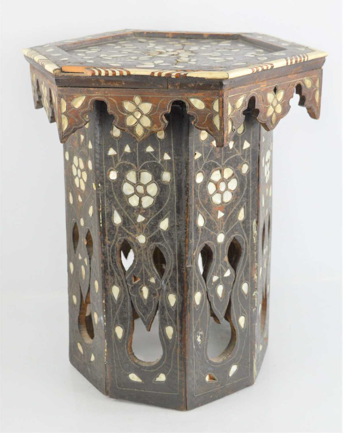 Lot 612 - An early 20th century Indian hexagonal table...