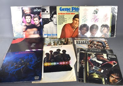 Lot 15 - A group of vinyl records, some signed to...