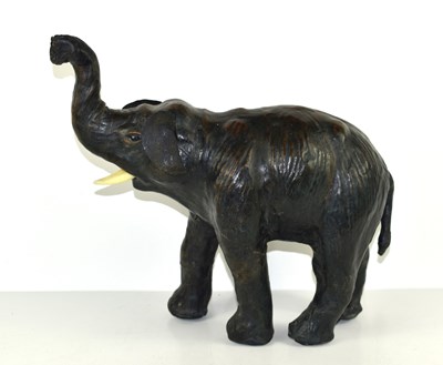 Lot 212 - A small leather Liberty style model elephant,...