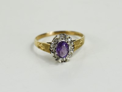 Lot 86 - A 9ct gold, amethyst and diamond dress ring,...