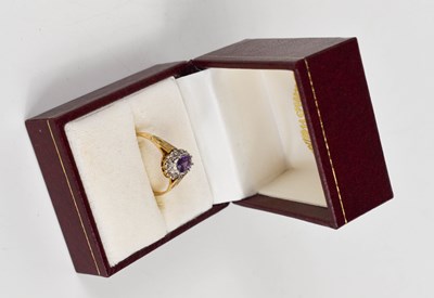 Lot 86 - A 9ct gold, amethyst and diamond dress ring,...