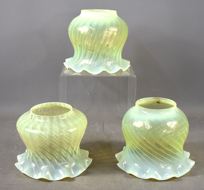 Lot 441 - A group of three Victorian oil lamp vaseline...