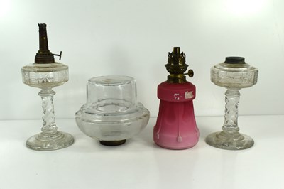 Lot 451 - .A group of four Victorian and later oil lamps,...