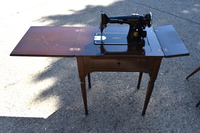 Lot 188 - A Singer sewing machine on stand.