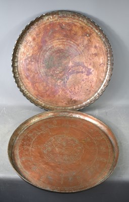 Lot 374 - Two large Iranian/Middle Eastern copper trays,...