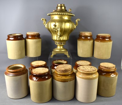 Lot 319 - A group of twelve stoneware jars, of...