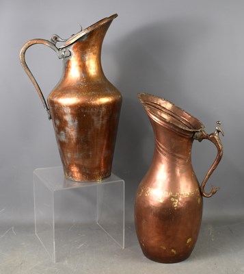 Lot 370 - Two similar tall Iranian/Middle Eastern jugs,...