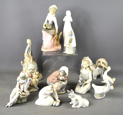 Lot 331 - A group of Lladro and other pottery figurines...