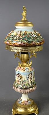 Lot 457 - A Capodimonte table lamp, the lamp with relief...