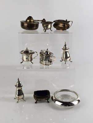 Lot 226 - A group of silver to include salt and pepper,...