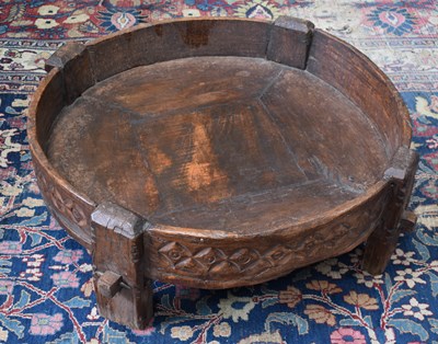 Lot 488 - A carved wooden rice pounder stool, likely...