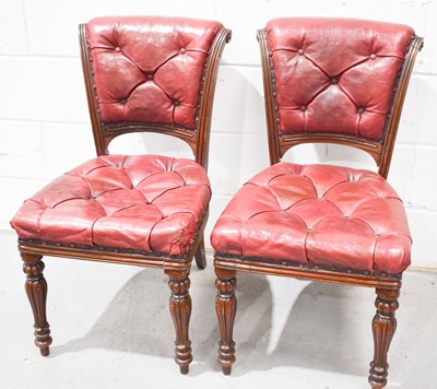 Lot 467 - A pair of mahogany and red leather chairs,...