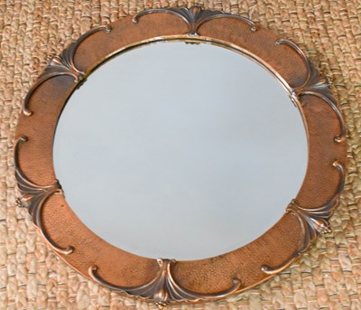 Lot 455 - An Art Nouveau style hammered copper mirror of...