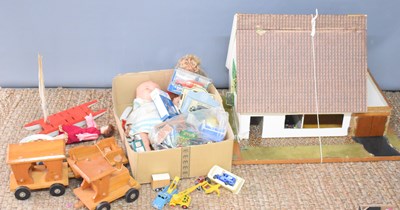 Lot 125 - A group of toys to include dolls house, dolls,...