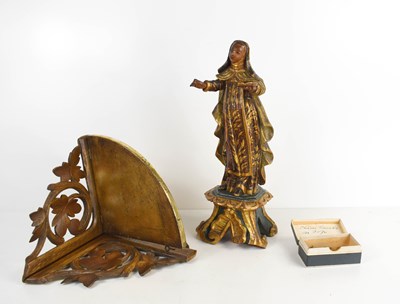 Lot 208 - A 19th century Spanish figure of a female...