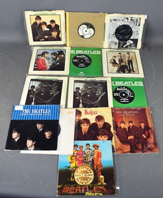 Lot 36 - A group of Beatles 45's including Love me Do,...
