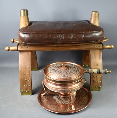 Lot 380 - An Iranian camel stool together with a copper...