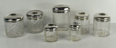 Lot 205 - A group of seven sterling silver topped...