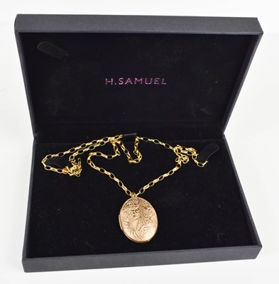 Lot 96 - A 9ct gold locket of oval form with foliate...