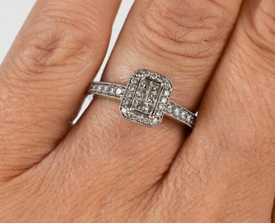 Lot 213 - A 9ct white gold and diamond dress ring, the...