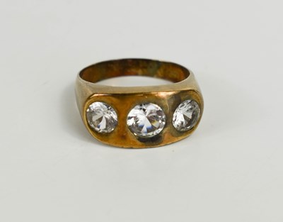 Lot 99 - A 9ct gold three stone ring, set with white...