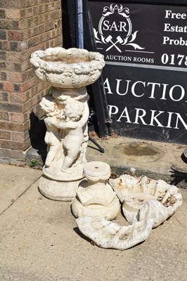 Lot 473 - A reconstituted stone bird bath with cherub...