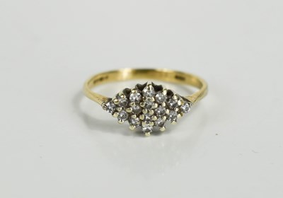 Lot 92 - A 9ct gold and diamond cluster ring, the...