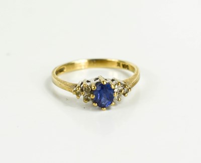 Lot 179 - A 9ct gold, sapphire and diamond ring, the...