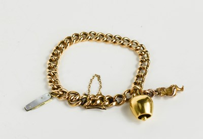 Lot 210 - A 15ct gold curb link charm bracelet with bar...