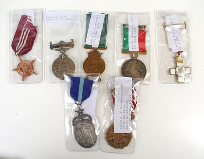 Lot 18 - A group of military medals to include a WWII...
