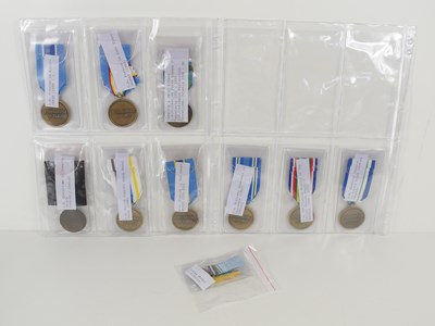 Lot 20 - A group of U.N medals to include Military...