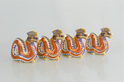 Lot 117 - A group of four Royal Crown Derby dragon...