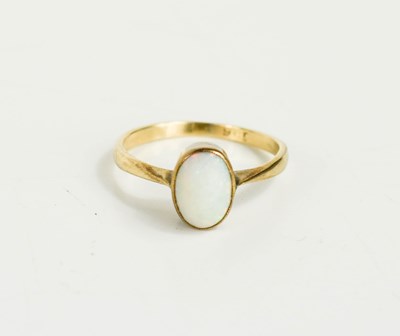 Lot 63 - A 9ct gold and opal ring, the oval cabouchone...