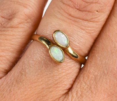 Lot 97 - A 9ct gold and opal snake's head ring, set...