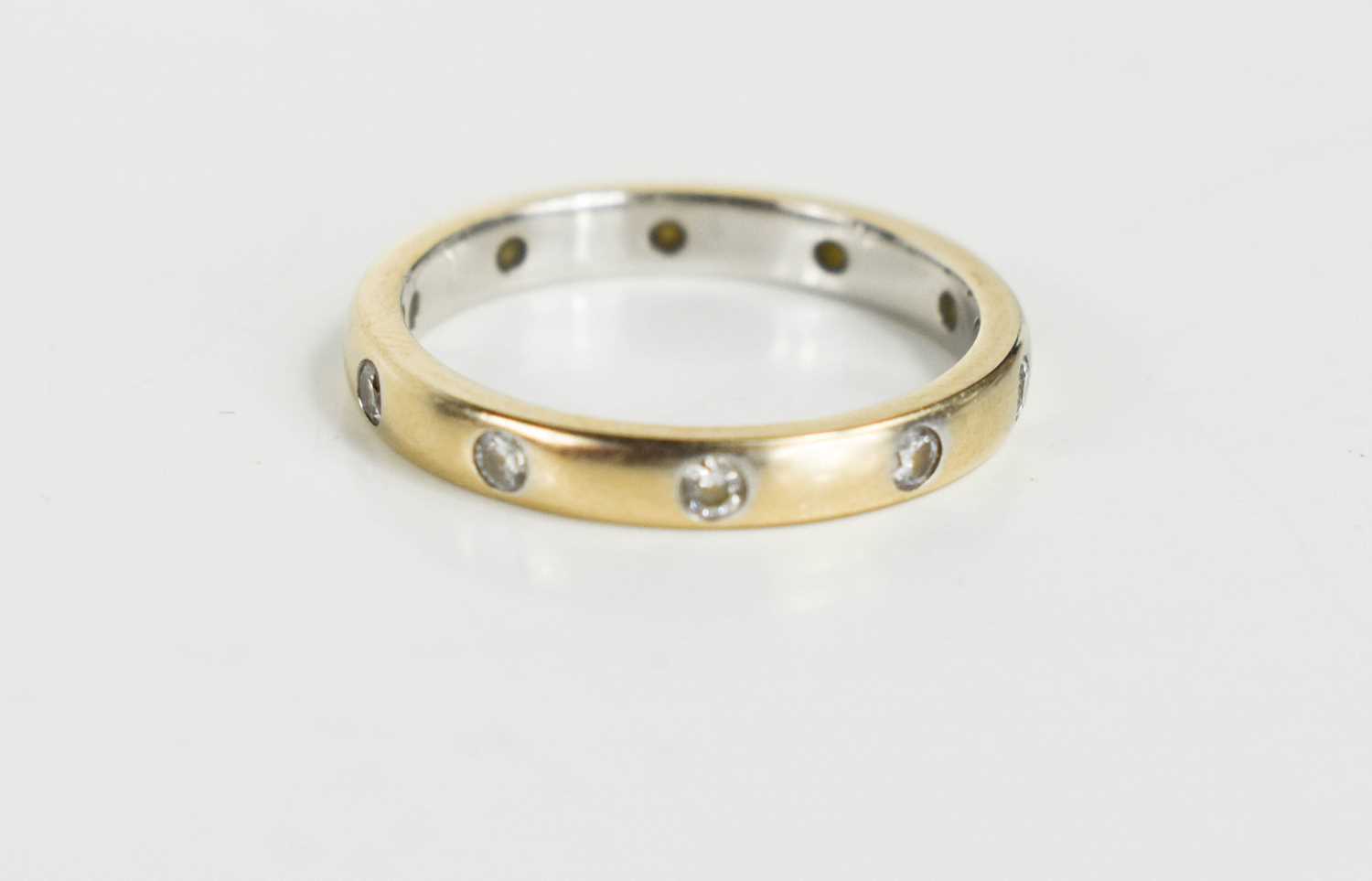 Lot 171 - An 18ct gold and white gold wedding band set...