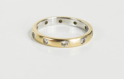 Lot 171 - An 18ct gold and white gold wedding band set...