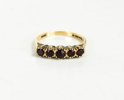 Lot 61 - A 9ct gold and garnet five stone ring, size K,...