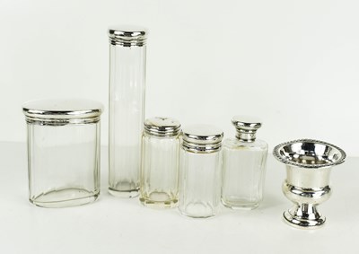 Lot 369 - A group of silver topped cut glass dressing...