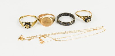 Lot 147 - A group of three 9ct gold dress rings,...