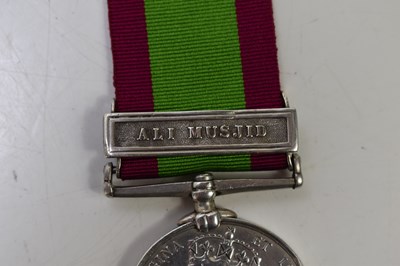 Lot 64 - A group of medals and military cloth badges to...