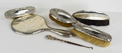 Lot 384 - A group of silver backed dressing table items,...