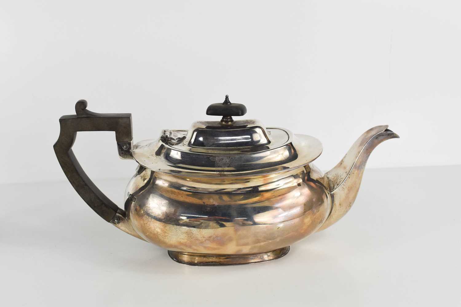 Lot 440 - An Art Deco silver teapot of squat form, with...