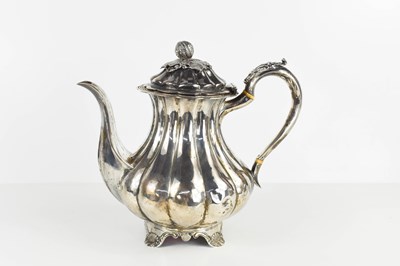 Lot 443 - A George III silver teapot, of fluted pot...