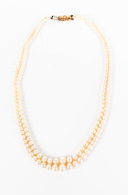 Lot 174 - A double string of vintage cultured pearls, of...