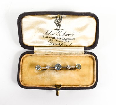 Lot 206 - An aquamarine and diamond bar brooch, set with...