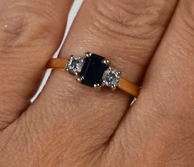 Lot 234 - An 18ct gold, sapphire and diamond three stone...