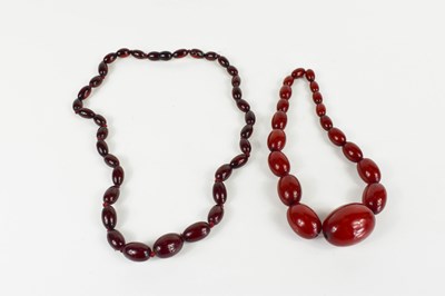 Lot 193 - A string of vintage cherry amber beads, the...