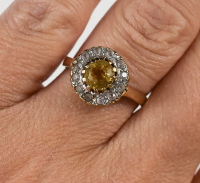 Lot 101 - A 9ct gold and citrine dress ring, the central...